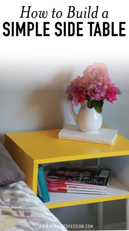 Yellow table with vase of flowers and a book image.