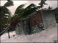 House is flooded by the sea on the coast of La Ceiba, Honduras, in October 1998