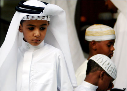 Boys attend Eid al-Fitr dawn prayers at a mosque in Riffa, Bahrain