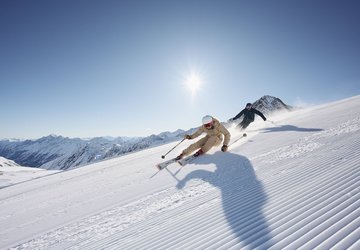 Two skiers skiing on the Stubai Glacier