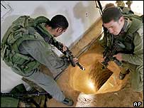 Israeli soldiers inspect arms smuggling tunnel in house in Rafah