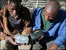 Zimbabweans listen to the radio for results