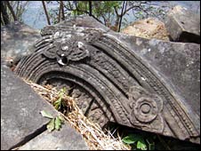 A fallen stone block, with elaborate carvings